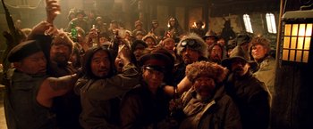 Movie still from “Charlie's Angels: Full Throttle” (2003), directed by McG – A group of people in a room with lights on; Medium shot, High angle