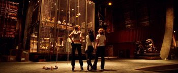 Movie still from “Charlie's Angels: Full Throttle” (2003), directed by McG – A group of people standing on a stage; Wide shot, Low angle