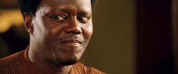 Movie still from “Charlie's Angels: Full Throttle” (2003), directed by McG – A man's eyes and face; Close Up shot, Low angle