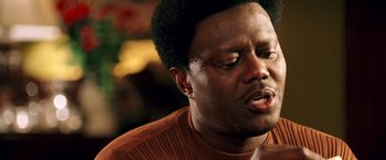 Movie still from “Charlie's Angels: Full Throttle” (2003), directed by McG – A person wearing a brown sweater; Close Up shot, High angle