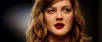 Movie still from “Charlie's Angels: Full Throttle” (2003), directed by McG – A person wearing a red lipstick; Close Up shot, Overhead angle