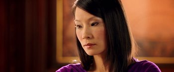 Movie still from “Charlie's Angels: Full Throttle” (2003), directed by McG – A person wearing a purple shirt; Close Up shot, Over the shoulder angle