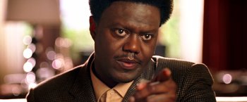 Movie still from “Charlie's Angels: Full Throttle” (2003), directed by McG – A person wearing a suit and tie; Close Up shot, Low angle