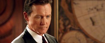 Movie still from “Charlie's Angels: Full Throttle” (2003), directed by McG – A man in a suit and tie; Close Up shot, Over the shoulder angle