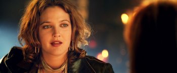 Movie still from “Charlie's Angels: Full Throttle” (2003), directed by McG – A person wearing a black jacket; Close Up shot, Low angle