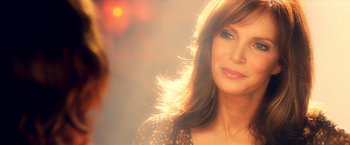 Movie still from “Charlie's Angels: Full Throttle” (2003), directed by McG – A person with long brown hair; Close Up shot, Over the shoulder angle