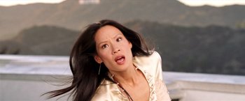 Movie still from “Charlie's Angels: Full Throttle” (2003), directed by McG – A woman with long black hair is looking surprised; Close Up shot, Low angle