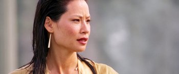 Movie still from “Charlie's Angels: Full Throttle” (2003), directed by McG – A person wearing a yellow shirt; Close Up shot, Over the shoulder angle