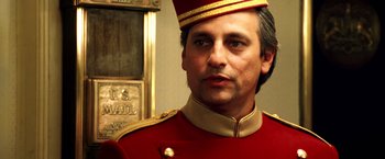 Movie still from “Charlie's Angels: Full Throttle” (2003), directed by McG – A person wearing a uniform; Close Up shot, Low angle