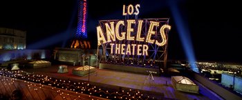 Movie still from “Charlie's Angels: Full Throttle” (2003), directed by McG – The los angeles theater sign is lit up at night; Extreme Wide shot, High angle