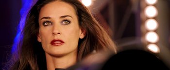 Movie still from “Charlie's Angels: Full Throttle” (2003), directed by McG – A woman's face with long brown hair; Close Up shot, Over the shoulder angle