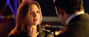 Movie still from “Charlie's Angels: Full Throttle” (2003), directed by McG – A woman in a leather jacket looking at a man in a leather jacket; Close Up shot, Over the shoulder angle
