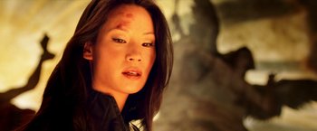 Movie still from “Charlie's Angels: Full Throttle” (2003), directed by McG – A person wearing a black shirt; Close Up shot, Low angle