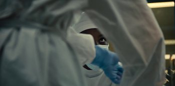 Movie still from “Charm City Kings” (2020), directed by Angel Manuel Soto – A person wearing a mask and a white gown; Extreme Close Up shot, Low angle