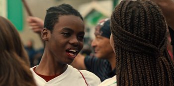 Movie still from “Charm City Kings” (2020), directed by Angel Manuel Soto – A group of young people standing next to each other; Close Up shot, Over the shoulder angle