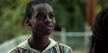 Movie still from “Charm City Kings” (2020), directed by Angel Manuel Soto – A person looking to his left; Close Up shot, Low angle