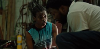 Movie still from “Charm City Kings” (2020), directed by Angel Manuel Soto – A young man talking to another man in a room; Close Up shot, Over the shoulder angle