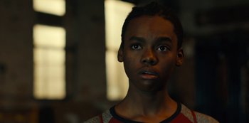 Movie still from “Charm City Kings” (2020), directed by Angel Manuel Soto – A young man with a serious look on his face; Close Up shot, Low angle
