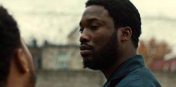 Movie still from “Charm City Kings” (2020), directed by Angel Manuel Soto – A person with a beard; Close Up shot, Over the shoulder angle