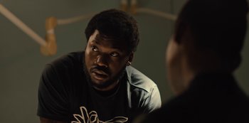 Movie still from “Charm City Kings” (2020), directed by Angel Manuel Soto – A man looking into a mirror while sitting down; Close Up shot, Over the shoulder angle