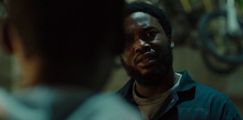 Movie still from “Charm City Kings” (2020), directed by Angel Manuel Soto – A person with a beard; Close Up shot, Over the shoulder angle