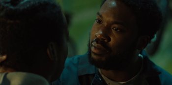 Movie still from “Charm City Kings” (2020), directed by Angel Manuel Soto – A man with a beard is talking to another man; Close Up shot, Over the shoulder angle