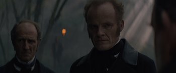 A man with a beard and a black jacket