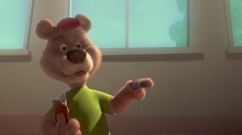 Movie still from “Chicken Little” (2005), directed by Mark Dindal – A teddy bear holding a cell phone in his hand; Close Up shot, High angle