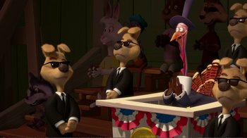 Movie still from “Chicken Little” (2005), directed by Mark Dindal – A group of cartoon characters sitting in front of a table; Wide shot, Low angle