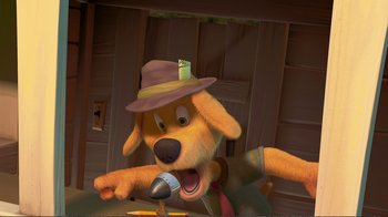 Movie still from “Chicken Little” (2005), directed by Mark Dindal – A cartoon dog wearing a hat and holding a microphone in his mouth; Medium shot, High angle