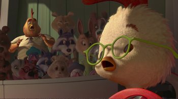 Movie still from “Chicken Little” (2005), directed by Mark Dindal – A stuffed animal wearing glasses with other stuffed animals in the background; Medium shot, Over the shoulder angle