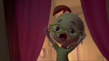 Movie still from “Chicken Little” (2005), directed by Mark Dindal – An animated chicken wearing a pair of green glasses; Medium shot, Low angle