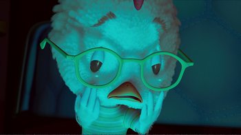 Movie still from “Chicken Little” (2005), directed by Mark Dindal – A stuffed chicken wearing glasses and a t - shirt; Close Up shot, High angle