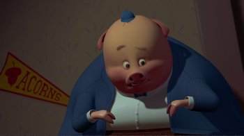 Movie still from “Chicken Little” (2005), directed by Mark Dindal – A cartoon pig sitting at a table in front of a wall; Close Up shot, High angle