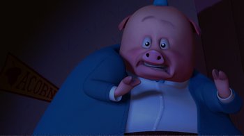 Movie still from “Chicken Little” (2005), directed by Mark Dindal – A cartoon pig wearing a blue jacket and a white shirt; Medium shot, High angle