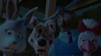 Movie still from “Chicken Little” (2005), directed by Mark Dindal – A group of cartoon dogs with a man in the background; Close Up shot, Low angle