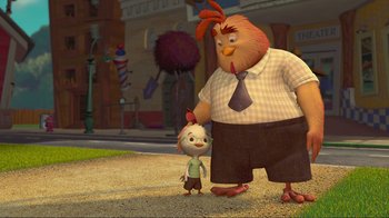 Movie still from “Chicken Little” (2005), directed by Mark Dindal – A man and a child standing next to each other on the street; Wide shot, Low angle