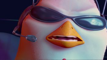 Movie still from “Chicken Little” (2005), directed by Mark Dindal – An animated penguin with sunglasses and a toothbrush in his mouth; Extreme Close Up shot, Low angle