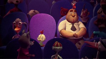 Movie still from “Chicken Little” (2005), directed by Mark Dindal – A group of people sitting on purple seats; Wide shot, High angle