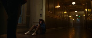 Movie still from “Child's Play” (2019), directed by Lars Klevberg – A person sitting on the ground in a room; Wide shot, High angle