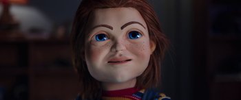 Movie still from “Child's Play” (2019), directed by Lars Klevberg – The face of a doll with blue eyes; Close Up shot, Low angle