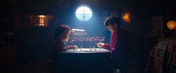 Movie still from “Child's Play” (2019), directed by Lars Klevberg – Two children are playing a game with candles; Medium shot, Over the shoulder angle
