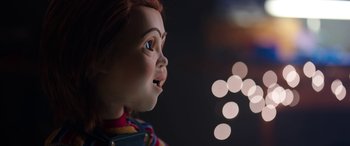 Movie still from “Child's Play” (2019), directed by Lars Klevberg – The face of a chucky doll; Close Up shot, Over the shoulder angle