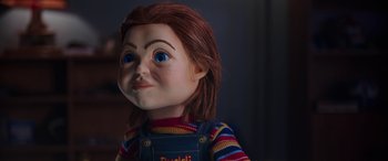 Movie still from “Child's Play” (2019), directed by Lars Klevberg – The head of a chucky doll; Close Up shot, Over the shoulder angle