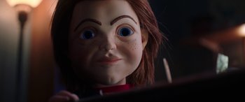 Movie still from “Child's Play” (2019), directed by Lars Klevberg – The face of a doll with blue eyes; Close Up shot, Low angle