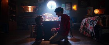 Movie still from “Child's Play” (2019), directed by Lars Klevberg – Two young children sitting on the ground in a room; Wide shot, Over the shoulder angle