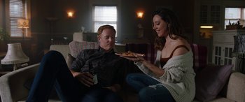 Movie still from “Child's Play” (2019), directed by Lars Klevberg – A man and a woman sitting in a living room; Medium shot, Over the shoulder angle