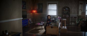 Movie still from “Child's Play” (2019), directed by Lars Klevberg – A living room scene with a doll in the middle of the room; Wide shot, High angle
