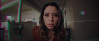 Movie still from “Child's Play” (2019), directed by Lars Klevberg – A person with long hair; Close Up shot, Overhead angle