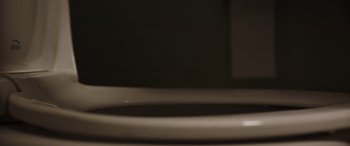 Movie still from “Child's Play” (2019), directed by Lars Klevberg – View of a white toilet bowl; Extreme Close Up shot, Low angle